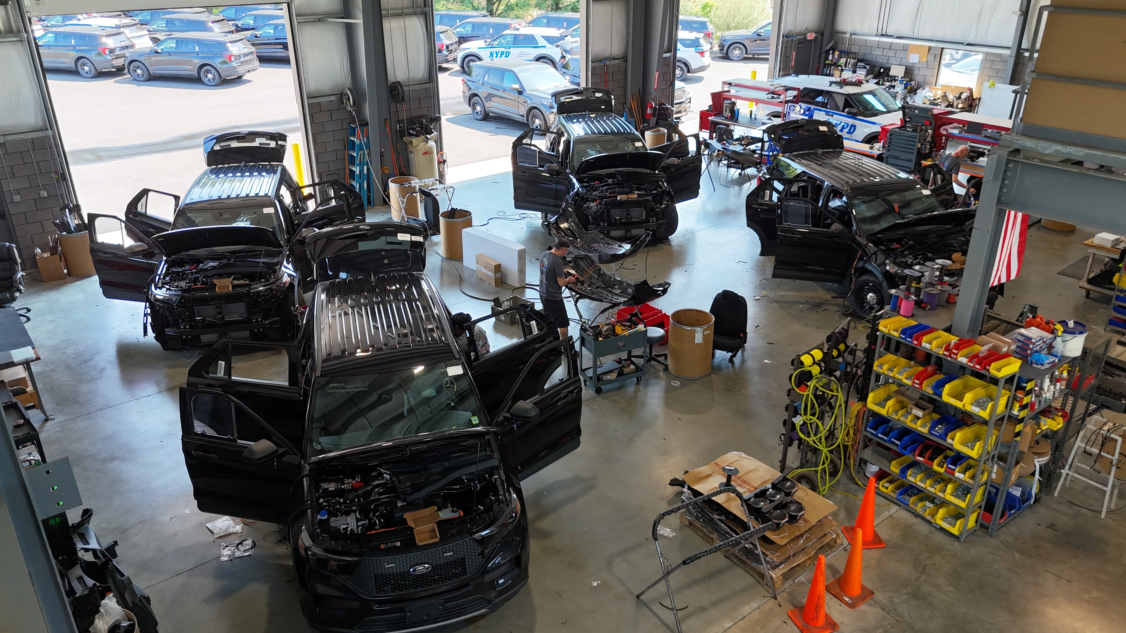 Siren Tech shop floor with NYPD vehicles being upfitted